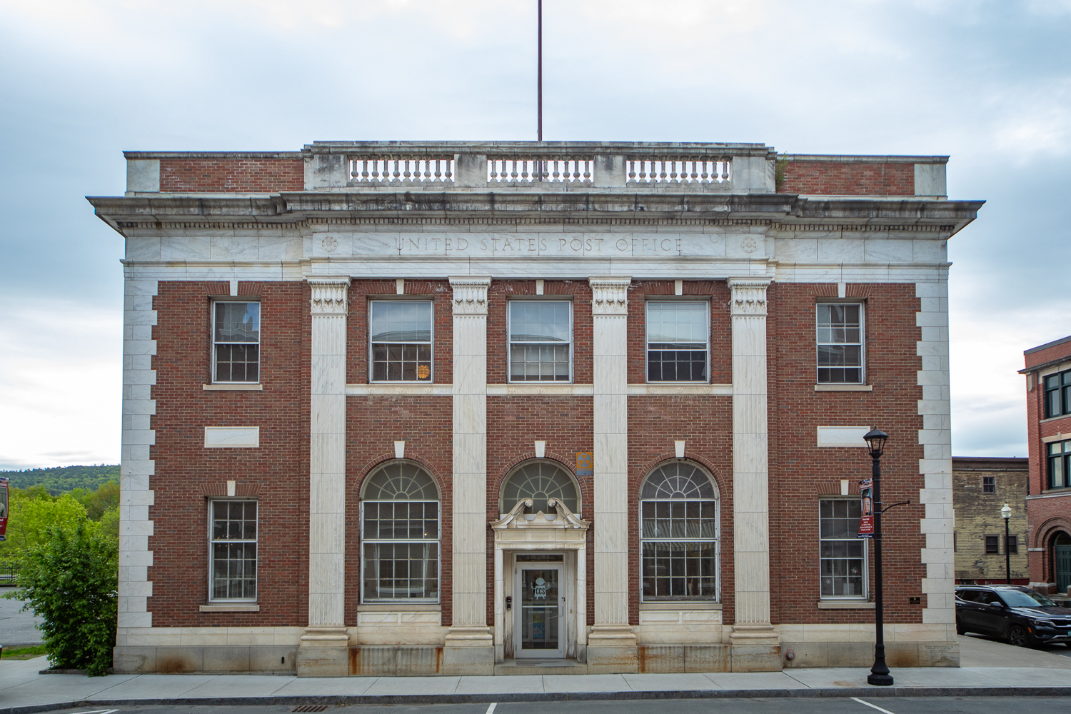 a large brick building with arched windows that says 'CCS' on the front door<br />
